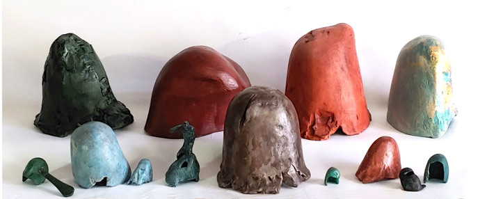 A range of sizes of Helmet Sculptures, Terra-cotta