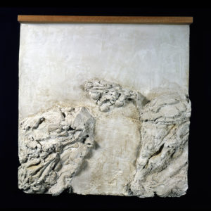 Abstract white relief sculpture with textured layers and organic forms, highlighting depth and movement in its composition. Relevant to contemporary art discussions.